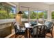Charming dining space with windows, a table, chairs, and deck access for relaxation at 95 Sanderling Ave., Georgetown, SC 29440