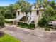Stately home with palm trees, a private gate, and mature landscaping, providing an elegant and secure residence at 95 Sanderling Ave., Georgetown, SC 29440