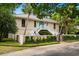 Stunning two-story home with white stairs, lovely gated entry, and lush landscaping at 95 Sanderling Ave., Georgetown, SC 29440