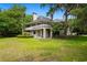 Charming two-story home with a spacious yard and mature trees offering a serene and inviting curb appeal at 95 Sanderling Ave., Georgetown, SC 29440