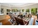 Airy living room with a comfortable white sofa, striped rug, and sunlit windows at 95 Sanderling Ave., Georgetown, SC 29440