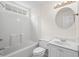 Bright bathroom with shower-tub combo, toilet and vanity with sink at 9580 Kings Rd., Myrtle Beach, SC 29572