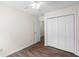 Bedroom showcasing wood-look floors, a closet, and fresh paint at 9580 Kings Rd., Myrtle Beach, SC 29572