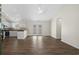 Spacious living room featuring vaulted ceilings, modern fan, and beautiful wood-look floors at 9580 Kings Rd., Myrtle Beach, SC 29572