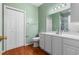Bathroom featuring white cabinets, a large mirror and ample storage, blending style and functionality at 100 Lazy Willow Ln. # 103, Myrtle Beach, SC 29588