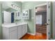 Bathroom featuring a vanity with ample storage and an ensuite bathroom, blending style and functionality at 100 Lazy Willow Ln. # 103, Myrtle Beach, SC 29588
