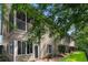 A ground-level view showcasing the exterior of the home and the screened in back patio at 100 Lazy Willow Ln. # 103, Myrtle Beach, SC 29588