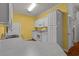 Bright kitchen with white cabinets, white appliances, and wood-look flooring at 100 Lazy Willow Ln. # 103, Myrtle Beach, SC 29588