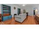 Bright living room with hardwood floors, comfortable seating, and custom built-ins at 100 Lazy Willow Ln. # 103, Myrtle Beach, SC 29588
