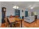 Spacious living room with wood floors, dining area, comfortable seating, and natural light at 100 Lazy Willow Ln. # 103, Myrtle Beach, SC 29588