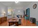 Open-concept living room featuring hardwood floors, furniture, and built in shelving at 100 Lazy Willow Ln. # 103, Myrtle Beach, SC 29588