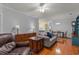 Bright living room with wood floors, comfortable seating, and a view into the kitchen at 100 Lazy Willow Ln. # 103, Myrtle Beach, SC 29588