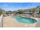 Community pool featuring a sun deck, lounge chairs, and palm trees at 100 Lazy Willow Ln. # 103, Myrtle Beach, SC 29588