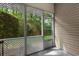 A closer view of the screened in porch with a view of the tree-lined property at 100 Lazy Willow Ln. # 103, Myrtle Beach, SC 29588