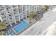 Aerial view of condo building, pool, hot tub, lounge chairs and beach access at 1012 N Waccamaw Dr. # 1107, Murrells Inlet, SC 29576