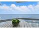 Balcony with coastal decor invites relaxation and offers stunning views of the ocean at 1012 N Waccamaw Dr. # 1107, Murrells Inlet, SC 29576