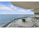 Relaxing balcony setup, complete with ocean views, offers a serene escape by the sea at 1012 N Waccamaw Dr. # 1107, Murrells Inlet, SC 29576