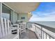 Relax on the oceanfront balcony with comfortable seating and beach views at 1012 N Waccamaw Dr. # 1107, Murrells Inlet, SC 29576