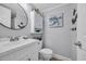 Well-lit bathroom featuring a white vanity and coastal decor at 1012 N Waccamaw Dr. # 1107, Murrells Inlet, SC 29576