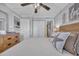 Bright and cheerful bedroom with coastal-themed decor, featuring a comfortable bed, ample storage, and a charming ceiling fan at 1012 N Waccamaw Dr. # 1107, Murrells Inlet, SC 29576