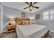 Cozy bedroom with beachy decor, including starfish pillows and a rustic wooden headboard, creating a tranquil seaside retreat at 1012 N Waccamaw Dr. # 1107, Murrells Inlet, SC 29576