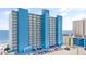The Water's Edge resort building offers beachfront condo living with private balconies and plentiful parking for owners and guests at 1012 N Waccamaw Dr. # 1107, Murrells Inlet, SC 29576