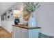 Charming hallway with coastal decor featuring beadboard, decorative fish, and a lamp, creating a welcoming beach-themed ambiance at 1012 N Waccamaw Dr. # 1107, Murrells Inlet, SC 29576