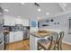 Well-lit kitchen featuring a breakfast bar and decorative backsplash at 1012 N Waccamaw Dr. # 1107, Murrells Inlet, SC 29576