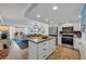Open concept kitchen and living area with an island and stainless steel appliances at 1012 N Waccamaw Dr. # 1107, Murrells Inlet, SC 29576