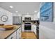 Kitchen featuring white cabinets and stainless steel appliances at 1012 N Waccamaw Dr. # 1107, Murrells Inlet, SC 29576