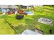 Spacious backyard featuring a pool, trampoline, deck, and patio with firepit and outdoor seating at 1051 Academy Dr., Conway, SC 29526