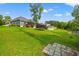 Grassy backyard with trampoline and home view at 1051 Academy Dr., Conway, SC 29526