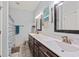 Bathroom featuring double sinks with marble countertops and framed mirrors at 1051 Academy Dr., Conway, SC 29526