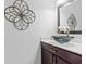 The bathroom features a modern vanity with glass sink and designer faucet at 1051 Academy Dr., Conway, SC 29526