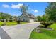 Long driveway leading to a charming home with a 2-car garage and manicured landscaping at 1051 Academy Dr., Conway, SC 29526