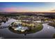 Aerial view of the community clubhouse, pool, and lake at 1058 East Isle Of Palms Ave., Myrtle Beach, SC 29579