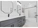 Well-lit bathroom with double vanity, modern fixtures, and framed mirrors at 1058 East Isle Of Palms Ave., Myrtle Beach, SC 29579