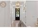 Bright entryway with wood floors, decorative lighting, and views through the front door at 1058 East Isle Of Palms Ave., Myrtle Beach, SC 29579