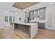 Open concept kitchen with an island, gray cabinets, stainless steel appliances, adjacent to dining area at 1058 East Isle Of Palms Ave., Myrtle Beach, SC 29579