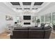 Spacious living room featuring a unique ceiling, built-in shelves, and comfortable leather seating at 1058 East Isle Of Palms Ave., Myrtle Beach, SC 29579