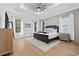Elegant bedroom with a tray ceiling, neutral tones, and plenty of natural light at 1058 East Isle Of Palms Ave., Myrtle Beach, SC 29579
