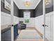 Stylish home office with dark grey walls, wainscoting, and a comfortable chair at 1058 East Isle Of Palms Ave., Myrtle Beach, SC 29579