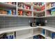 Well-stocked pantry with white shelving, grey tile backsplash, and appliances at 1058 East Isle Of Palms Ave., Myrtle Beach, SC 29579
