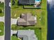 This aerial view showcases the home's roof and concrete driveway with lush landscaping at 1068 Lizzie Ln., Surfside Beach, SC 29575