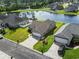 A nice aerial view of a home featuring lush landscaping and a serene pond, enhancing its curb appeal at 1068 Lizzie Ln., Surfside Beach, SC 29575