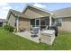 Spacious backyard featuring a patio, seating, and well-maintained lawn at 1068 Lizzie Ln., Surfside Beach, SC 29575