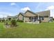 This backyard features a screened-in patio and plenty of space for outdoor enjoyment at 1068 Lizzie Ln., Surfside Beach, SC 29575