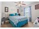 Comfortable bedroom with blue accents, a ceiling fan, and a view of the outside at 1068 Lizzie Ln., Surfside Beach, SC 29575