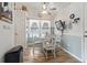 Charming dining area with a glass table, seating for four, and a view of the kitchen at 1068 Lizzie Ln., Surfside Beach, SC 29575