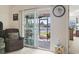 Inviting living room leading to a screened porch with a view of the lake at 1068 Lizzie Ln., Surfside Beach, SC 29575